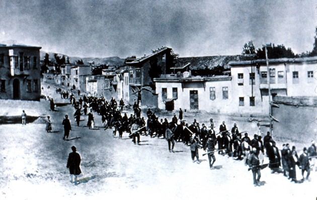 Turkish officials march Armenians toward the Syrian desert. According to a report relayed by a British member of parliament, quoted in The New York Times in August 1915, “the roads and the Euphrates are strewn with corpses of exiles, and those who survive are doomed to certain death. ... It is a plan to exterminate the whole Armenian people.” (AP)